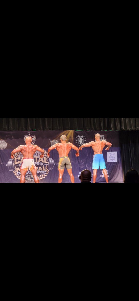 Back Men's Physique overall comparison at the second competition